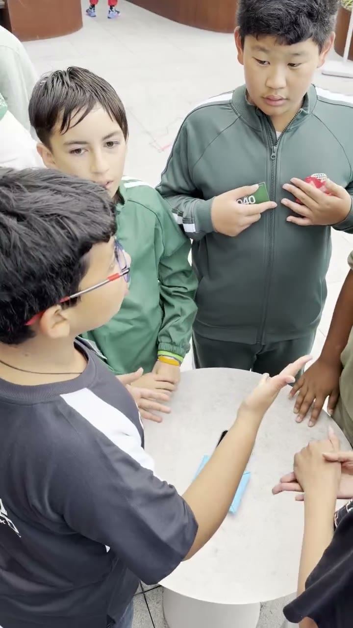Kids playing a card guessing game